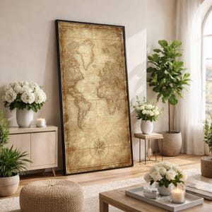 Puede incluir: Un mapa del mundo grande y enmarcado con una estética vintage. El mapa presenta una paleta de colores sepia y un diseño de rosa de los vientos. El marco negro añade un toque moderno a la cartografía clásica.