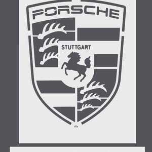 May include: A stencil featuring the Porsche crest logo with the text PORSCHE at the top and STUTTGART above a horse silhouette in the centre. The design includes four quadrants with antlers and horizontal bars. The word PORSCHE appears below the shield.
