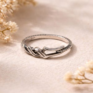 May include: A set of three ceramic mugs with a speckled, matte finish. Each mug features a different color: light blue, cream, and gray. The mugs have a simple, modern design and a comfortable handle.