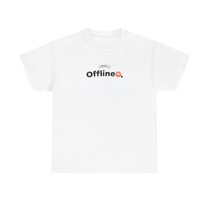 May include: White t-shirt featuring the word "Offline" in black, with a small banner above and a red Wi-Fi symbol. The tee has a crew neck design, suitable for everyday wear.