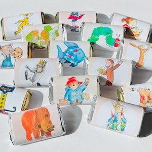May include: An assortment of wrapped chocolate bars, each featuring a different colorful illustration of a beloved children's book character. Characters include a bear, a fish, a caterpillar, and a monkey.