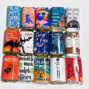 May include: A collection of wrapped books with colorful covers and titles like "Grand Union," "The Vanishing Half," and "Children of Blood and Bone." The books are arranged in a grid pattern, showcasing various designs and authors.