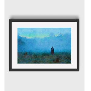May include: A framed landscape print featuring a watercolour painting of a solitary figure standing in a vast, misty blue field under a bright horizon. The artwork is encased in a simple black frame with a white mat border, creating a clean display.