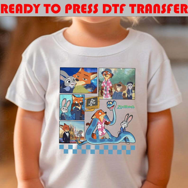 May include: White t-shirt featuring a colorful comic strip design with characters from the animated movie "Zootopia." The design includes images of a fox, a bunny, and other animal characters. The text "READY TO PRESS DTF TRANSFER" is at the top.