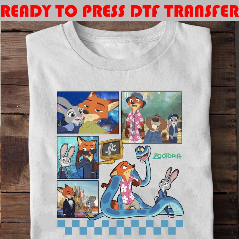 May include: White t-shirt featuring a colorful comic strip design with characters from the animated movie Zootopia. The design includes images of a fox, a rabbit, and other animal characters. The text "READY TO PRESS DTF TRANSFER" is at the top.