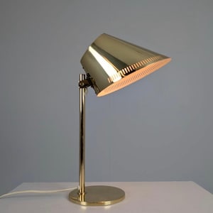 May include: A set of three ceramic mugs with a speckled, matte finish. The mugs are in shades of cream, light gray, and dark gray. Each mug has a simple, minimalist design, perfect for coffee or tea.