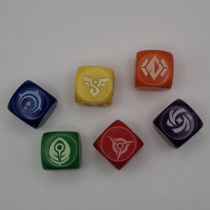 May include: Six colorful dice with unique symbols. The dice are in various colors: blue, yellow, orange, red, green, and purple. Each die features a different white symbol, likely for a game.