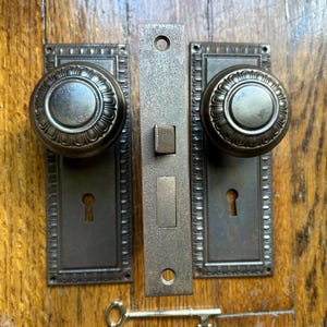 Antique Egg and Dart Steel Door Knobs and Backplates Hardware Set, “Thermia” Pattern