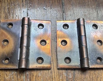 Par de bisagras de tope con acabado de cobre antiguo de 3"x3"