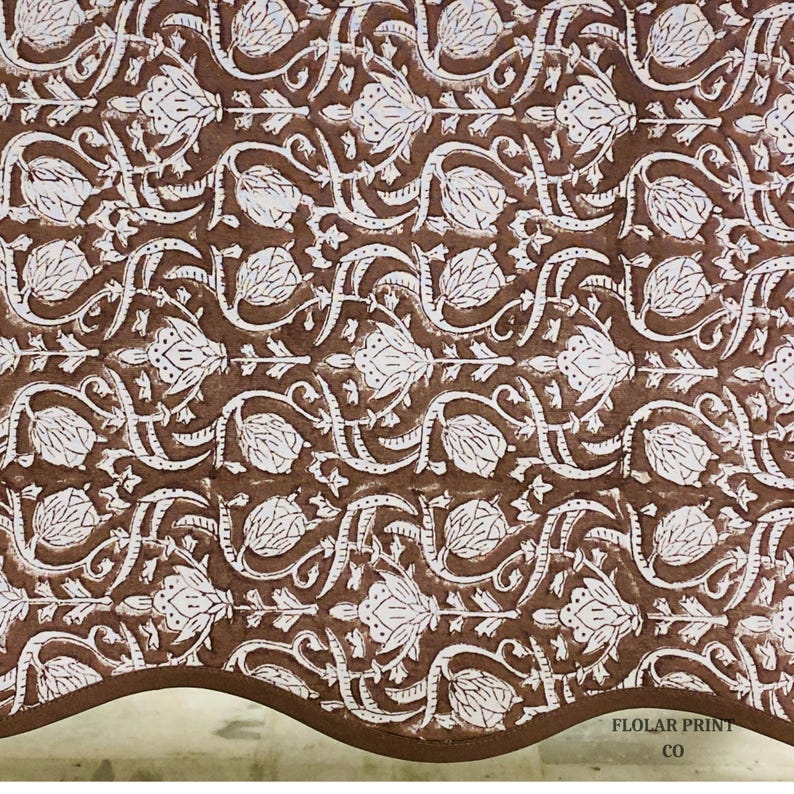 Handmade Mud Brown floral tablecloth crafted using traditional Indian block printing techniques and styled on a rectangular wooden dining table. The reusable cotton table linen with matching piping creates a timeless farmhouse and boho aesthetic perfect for entertaining guests, holiday celebrations, wedding receptions, kitchen décor, and stylish family dining experiences.