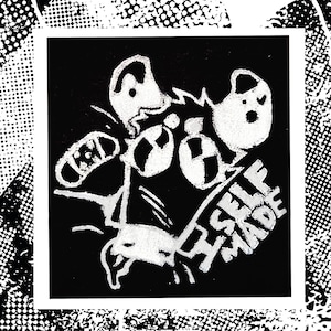 May include: A square black and white graphic print featuring a stylized cartoon rat with large eyes, a bandage on its head, and the text SELF MADE written in bold capital letters. The design uses high-contrast ink lines and a textured halftone effect.