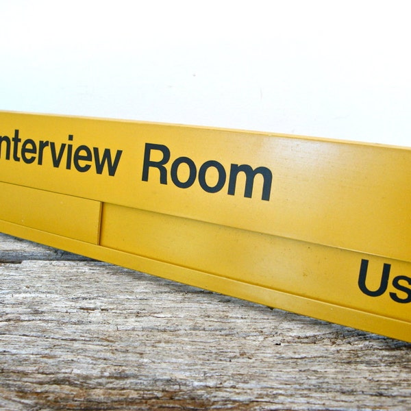 vintage industrial mustard yellow interview room sign