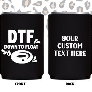 May include: Black can cooler with white text that reads "DTF DOWN TO FLOAT" on the front and "YOUR CUSTOM TEXT HERE" on the back. The background has a leopard print pattern.