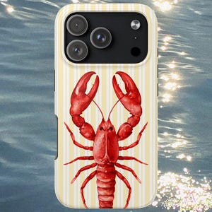 May include: A phone case featuring a watercolor illustration of a red lobster. The case has a cream and yellow striped background. The phone case has a camera and flash.