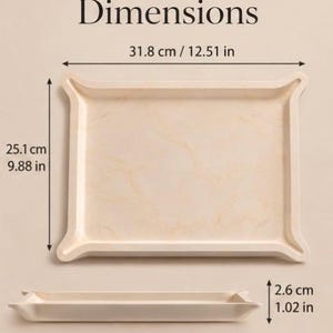 May include: A rectangular cream-coloured tray with a subtle marbled pattern and flared corners. The tray measures 31.8 cm wide by 25.1 cm high, with a depth of 2.6 cm. The text Dimensions is displayed above the tray.