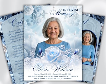 Puede incluir: Diseño de tarjeta conmemorativa con un retrato de una mujer mayor, rodeada de rosas azules y palomas. La tarjeta incluye el texto "In Loving Memory" y detalles sobre la vida y el servicio conmemorativo de Olivia Willson.