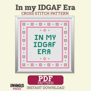 May include: A cross stitch pattern featuring the text In my IDGAF Era in dark green block letters. The design is framed by a border of small pink and yellow flowers on a white grid background. Below the frame, a red button reads PDF PATTERN.