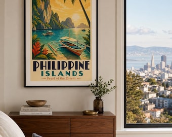 May include: A framed travel poster featuring a tropical landscape with palm trees, limestone cliffs, and outrigger boats on calm water. The text reads PHILIPPINE ISLANDS Pearl of the Orient in dark blue and red lettering against a warm yellow sky.