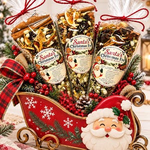 May include: Three clear cone-shaped bags filled with dried orange slices, cranberries, and cinnamon sticks, labeled Santa's Christmas Eve Simmer Blend, are arranged in a red metal sleigh decorated with a Santa Claus face and white snowflakes.