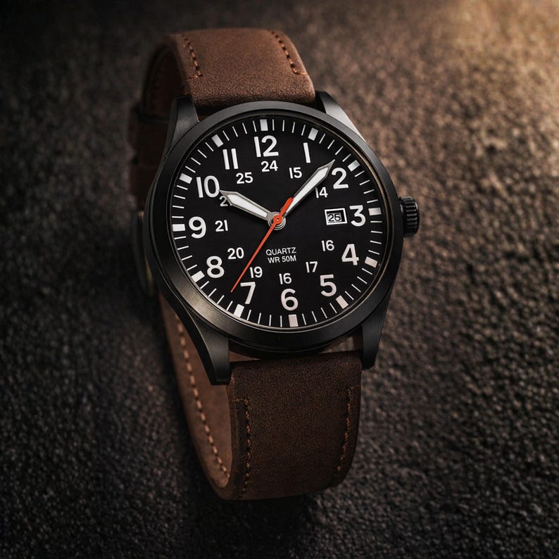 May include: Black wristwatch with a brown leather band. The watch face is black with white numerals and hands, and a red second hand. The watch has a date display at the 3 o'clock position. The watch case is black.
