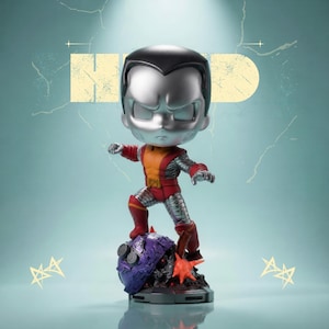 May include: A stylized figurine of a superhero with a large silver head and a red and yellow suit. The figure is standing on a purple and black base with a starburst design. The background is a light blue with the word "HEAD" in yellow.