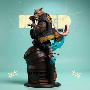 May include: A detailed statue of a rat-like character in a black and gold outfit, holding a sword. The figure sits atop a brown structure with a blue cloud-like element and a light blue background. The statue has a dynamic pose.