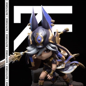 May include: A figurine of a character in a dynamic pose, featuring a dark color scheme with gold and blue accents. The figure has large ears and is holding a weapon. The text "RATH FORGE" is visible on the left side of the image.