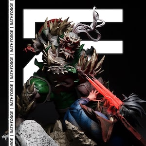 May include: A detailed statue of a monstrous figure with green armor, sharp spikes, and a menacing expression. The figure is battling another character with red energy beams. The background is black with white text that reads "RATH FORGE".