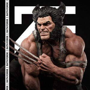 May include: A detailed statue of Wolverine, a character from the X-Men. The figure is muscular, with a fierce expression and claws extended. The statue has a black background with the text "RATH FORGE".