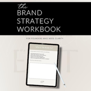 May include: A digital tablet displaying a brand strategy workbook with the title "The Brand Strategy Workbook" in white text on a black background. The text "For Founders Who Need Clarity" is below. A stylus rests on the tablet.