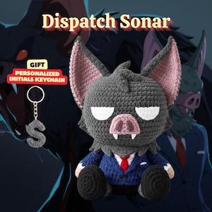 May include: A crocheted bat plush toy with a blue suit and red tie, white eyes, and a pink nose and ears. A personalized initial keychain with the letter "S" hangs on the left. The text "Dispatch Sonar" is at the top.