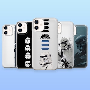 May include: A collection of phone cases featuring Star Wars designs. The cases display images of Stormtroopers, helmets, and the Star Wars logo in black, white, and blue. The cases are clear with a glossy finish.