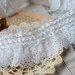 2 1/2 inch wide slightly ruffled ivory lace selling by the yard