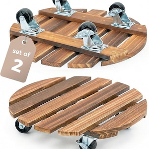 May include: Set of two wooden plant caddies with caster wheels. Each caddy is constructed from stained wood slats arranged in a circular pattern. The caddies have four black caster wheels attached to the underside for easy movement. The tag reads "set of 2".