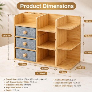 May include: A bamboo desk organizer with three blue fabric drawers and multiple open shelves. The unit measures 41.0 cm wide, 17.0 cm deep, and 30.5 cm high. It features top compartments, a left section with three drawers, and open right-side shelving.
