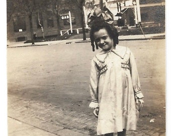 Big Hair Bow Little Girl Vintage Snapshot Casual Portrait Photography Vintage Girl’s Fashion Dress Shoes Gas Station Sign In Background