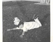 Big Hair Bow Little Girl Throws Herself On The Lawn Vintage Snapshot Victorian Fashion Photo