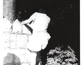 Vintage Snapshot "Taking Flight" Faceless Young Girl Climbs Over Fence Back To Camera Found Vernacular Photo