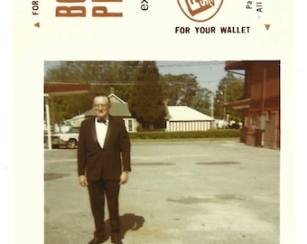 Vintage Color Snapshot Father Of The Bride Older Man Wearing Tux & Bow Tie Poses In Parking Lot Small Bonus Photo For Your Wallet