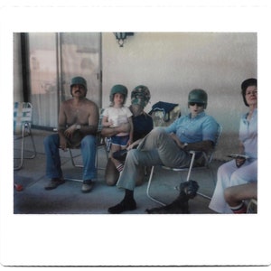 The Helmet Bunch Family Photo Kodak Instamatic Color Snapshot Motorcycle Football Baseball Helmets Hockey Mask Little Dog Instant Film