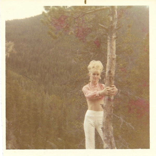 Platinum Blonde Bares Her Midriff Vintage Snapshot Young Woman 1960’s Stylish Tight White Pants & Beehive Hairstyle She Poses In The Forest