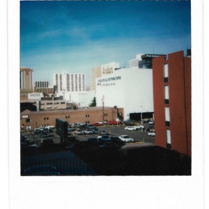 View From Hotel Window Vintage Color Polaroid Photo Cityscape Architecture Parking Lot Vacation Souvenir Color Snapshot Instant Film