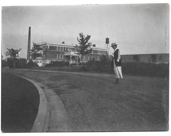 Woman Standing On Curved Road Near Water Tower Vintage Snapshot 1910’s Black & White Photo Vintage Hat