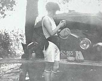 Vintage Photo Flapper Eating Apple Back To Camera Rolled Stockings Mood Abstract Ohio License Plate
