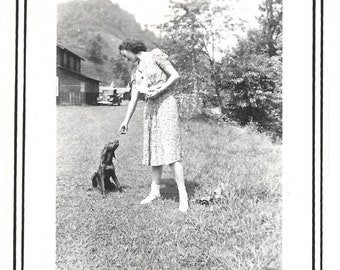 Hound Dog Puppy Vintage Photo Woman hands Dog Treat to Puppy With Long Ears Dog Training