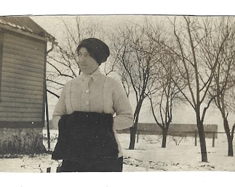 Winter Fashion Circa 1910 Antique Real Photo Postcard Young Woman Poses In The Snow Wearing Fur Hat & Large Muff Hand Warmer Sepia RPPC