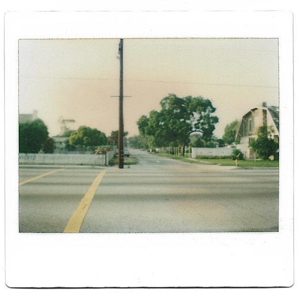 The Intersection 1970’s Kodak Instant Film Color Photo Country Road With Telephone Pole Water Pumping Windmill In The Distance Sunrise