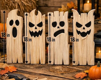 May include: Four vertical wooden boards shaped like ghosts and monsters, each featuring a black painted face with unique expressions. Each board is marked with a vertical arrow and the text 18 in, indicating a height of 18 inches for each piece.
