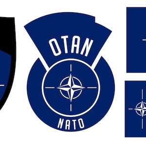 May include: A collection of NATO emblems in various shapes. The emblems feature a white compass rose on a blue background, with the word "NATO" in white. The shapes include a shield, a circle, and rectangular flags.