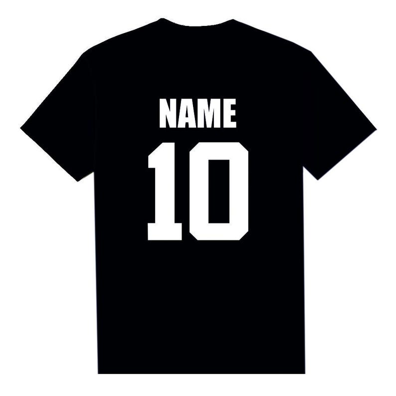 May include: Black t-shirt with white block lettering. The word "NAME" is above the number "10". The shirt is a solid black color, with the text and number in a bold, white font. This shirt is perfect for sports teams or personalized gifts.